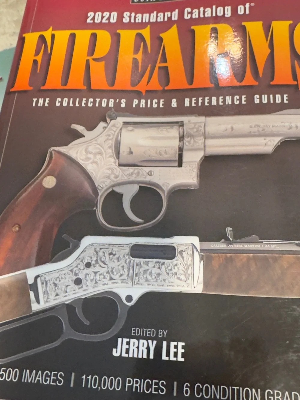 Firearms Reference Guide Book - Brown and Silver guns knive book